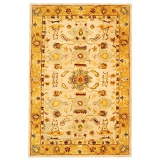 Handmade Tribal Ivory/ Gold Wool Rug (2 X 3) (IvoryPattern OrientalMeasures 0.625 inch thickTip We recommend the use of a non skid pad to keep the rug in place on smooth surfaces.All rug sizes are approximate. Due to the difference of monitor colors, so