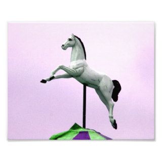 A white horse carousel statue against purple photo art