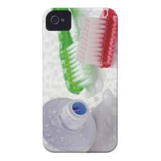 Close up of toothpaste and toothbrushes covered iPhone 4 Case Mate case