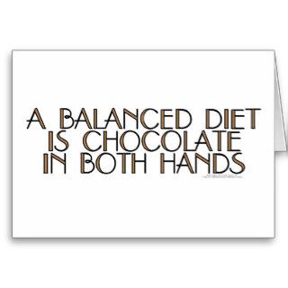 A balanced diet is chocolate in both hands card
