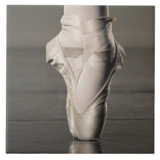 Feet of ballet dancer en pointe ceramic tile