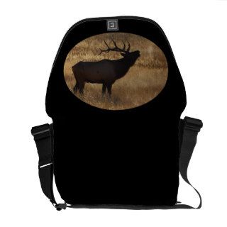 Bull elk bugling in silhouette courier bags