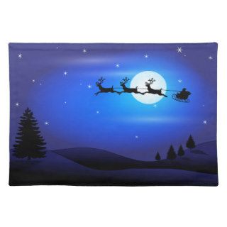 Santa and Reindeer Flying Across Blue Night Sky Placemats