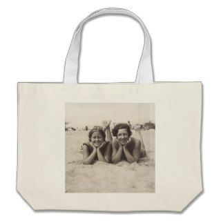 Beach tote with a vintage travel poster tote bags