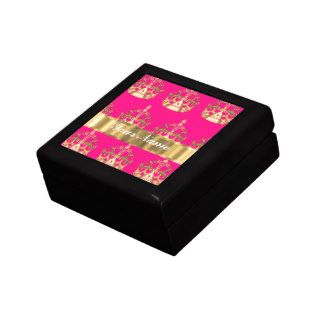 Gold crowns on hot pink jewelry boxes