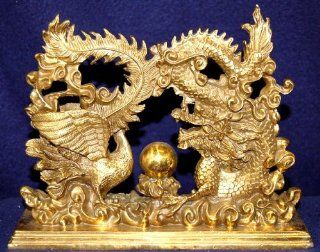 Bronze Dragon and Phoenix Bird Fighting over the Pearl of Wisdom.  Statues  