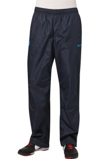 Nike Performance   T90 WOVEN   Tracksuit bottoms   blue