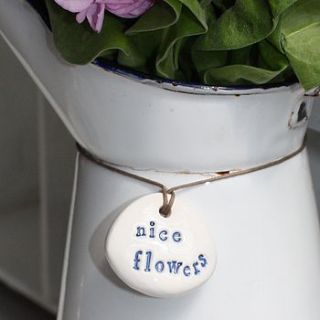 porcelain 'nice flowers' label by corn kist ceramics