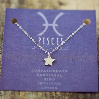 tiny star necklace on star sign card by j&s jewellery
