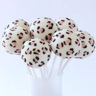 eight leopard print cake pops by the cake pop company