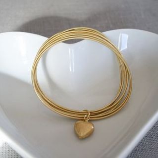 cluster of gold bracelets with heart by kathy jobson