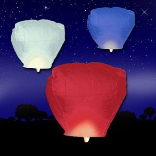 red, white and blue sky lanterns by light a lantern