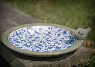 ceramic bird bath by the orchard