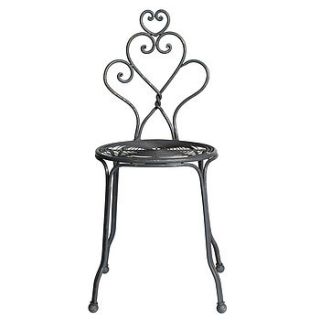 curled metal garden chair by out there interiors