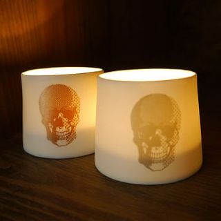 a pair of fine porcelain skull votives by deservedly so