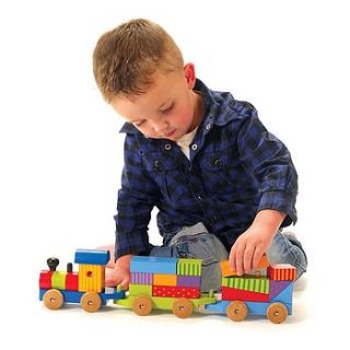 colourful puzzle train by knot toys