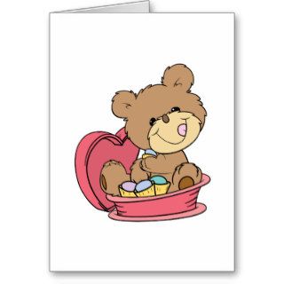 cute sweet little teddy bear eating valentine choc cards