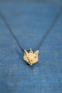 gold wolf pendant by beau & arrow