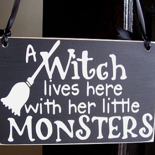 a witch lives here handmade sign by bobby loves rosie