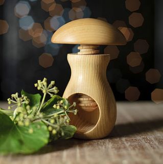 carved wooden mushroom nut cracker by the orchard