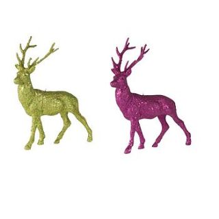 standing glitter reindeer by the contemporary home