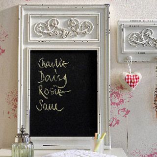 ornate antique style chalkboard by the orchard