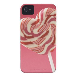 Red and white heart shaped lollipop against pink b iPhone 4 Case Mate cases