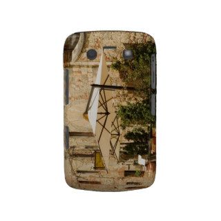 Potted plants and patio umbrellas in front of a Case Mate blackberry case