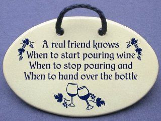A real friend knows when to start pouring wine, when to stop pouring wine, and when to hand over the bottle. Mountain Meadows ceramic plaques and wall signs with sayings and quotes about friendship and wine. Made by Mountain Meadows in the USA.   Home And 