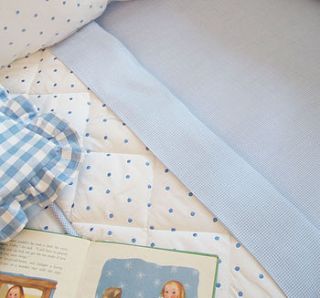 dotty cot bed quilt by babou