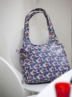 ditsy floral print water proof lizzie bag by caro london