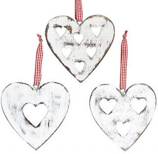 three assorted carved heart decorations by retreat home