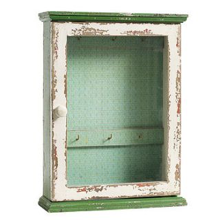 wallpapered wooden jewellery cabinet by out there interiors