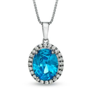 Oval London Blue Topaz and 1/4 CT. T.W. Diamond Pendant in Sterling