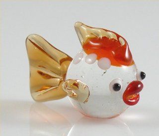 Shop Fish Round body with red lips, clear and Amber Glass Figurine animal 1 inch at the  Home Dcor Store. Find the latest styles with the lowest prices from Lizards