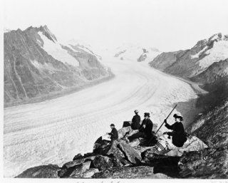 1800s photo Altsch Glacier graphic. Two men and two women seated on rocks nea a5  