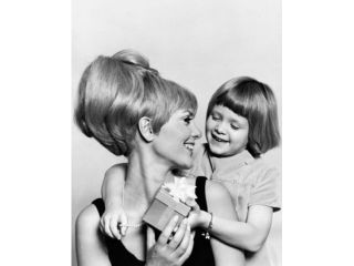 Close up of a girl giving a present to her mother Poster Print (18 x 24)